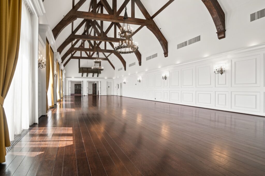 Ballroom with exposed timber trusses in a historic golf clubhouse