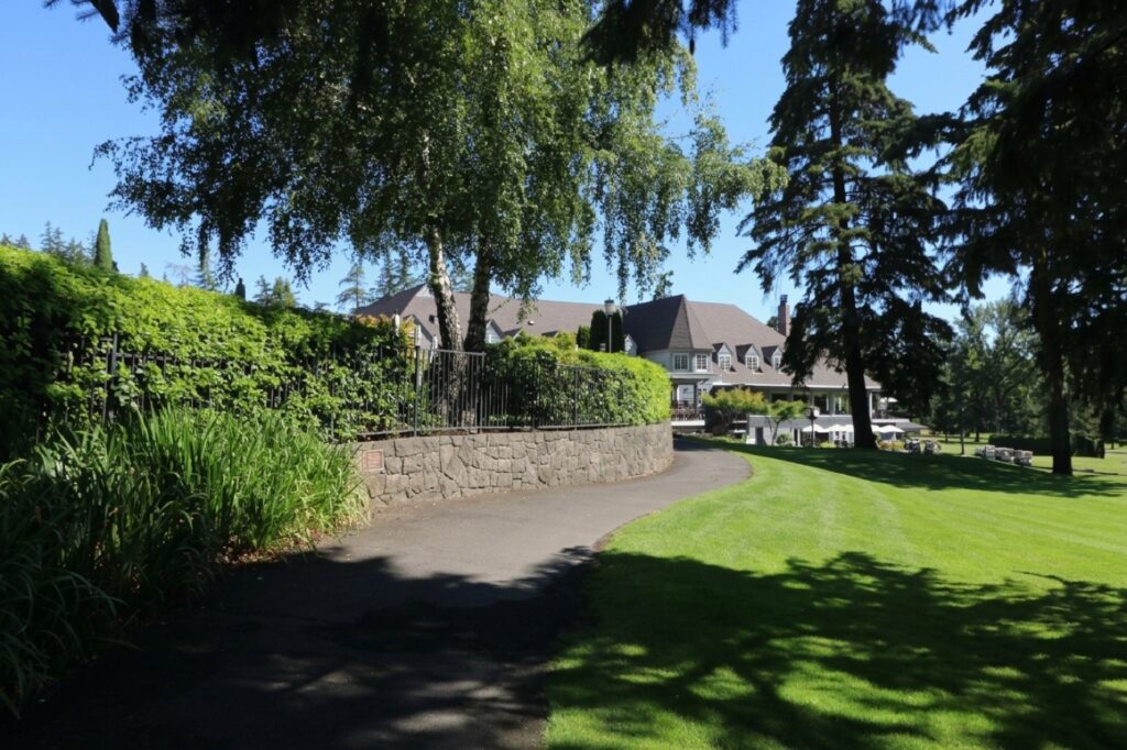 Historic golf clubhouse seen across the grounds